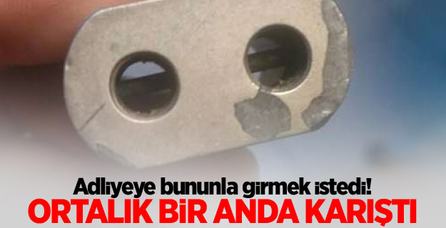 Adliyeye anahtarlık şeklinde silahla girmek istedi