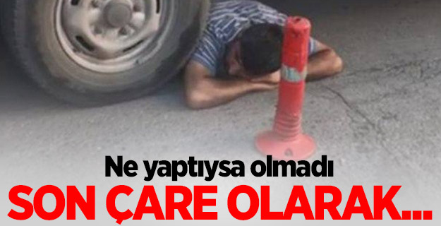 Direndi, işe yaramayınca aracın altına girdi!